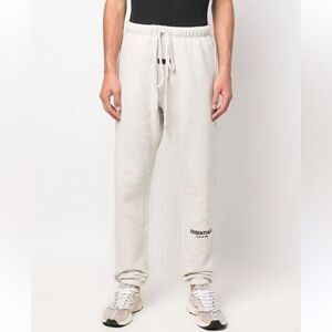 FEAR OF GOD ESSENTIALS
logo-print track pants